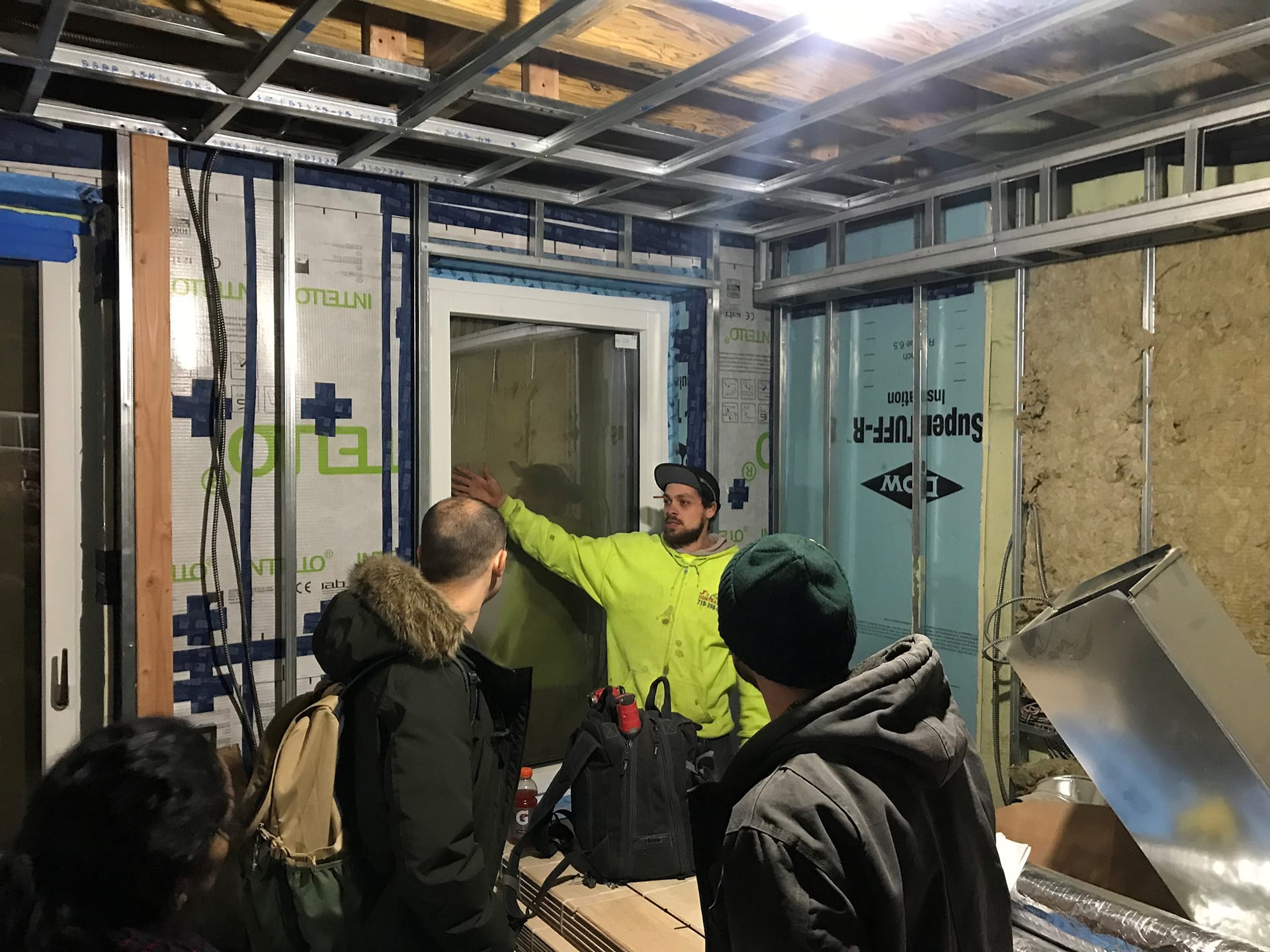A Passive House contractor describes Passive House window installation sequencing to CCNY students.