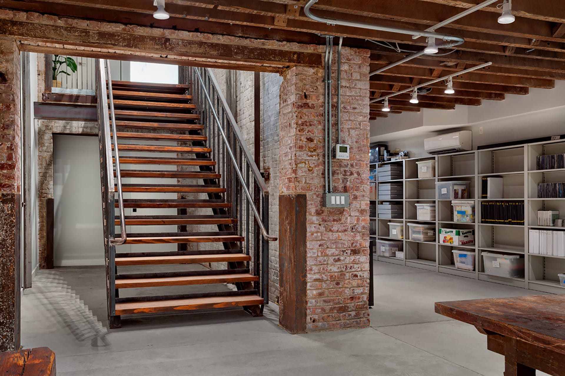 Staircase leading from the first floor to the cellar in a Brooklyn Heights building with storage space for an archive of Asian Art history