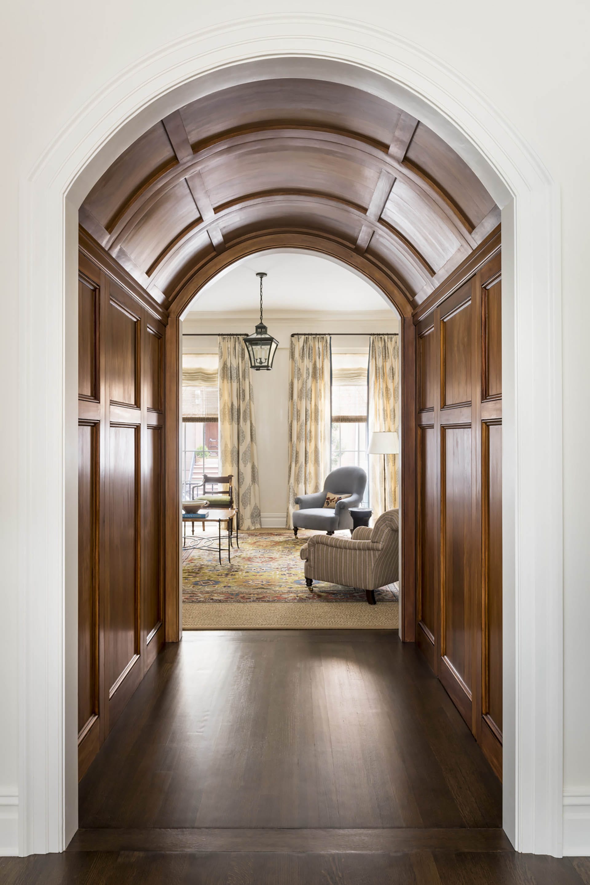 Paneled passageway leading from a dining room to a large den in a Brooklyn Heights House