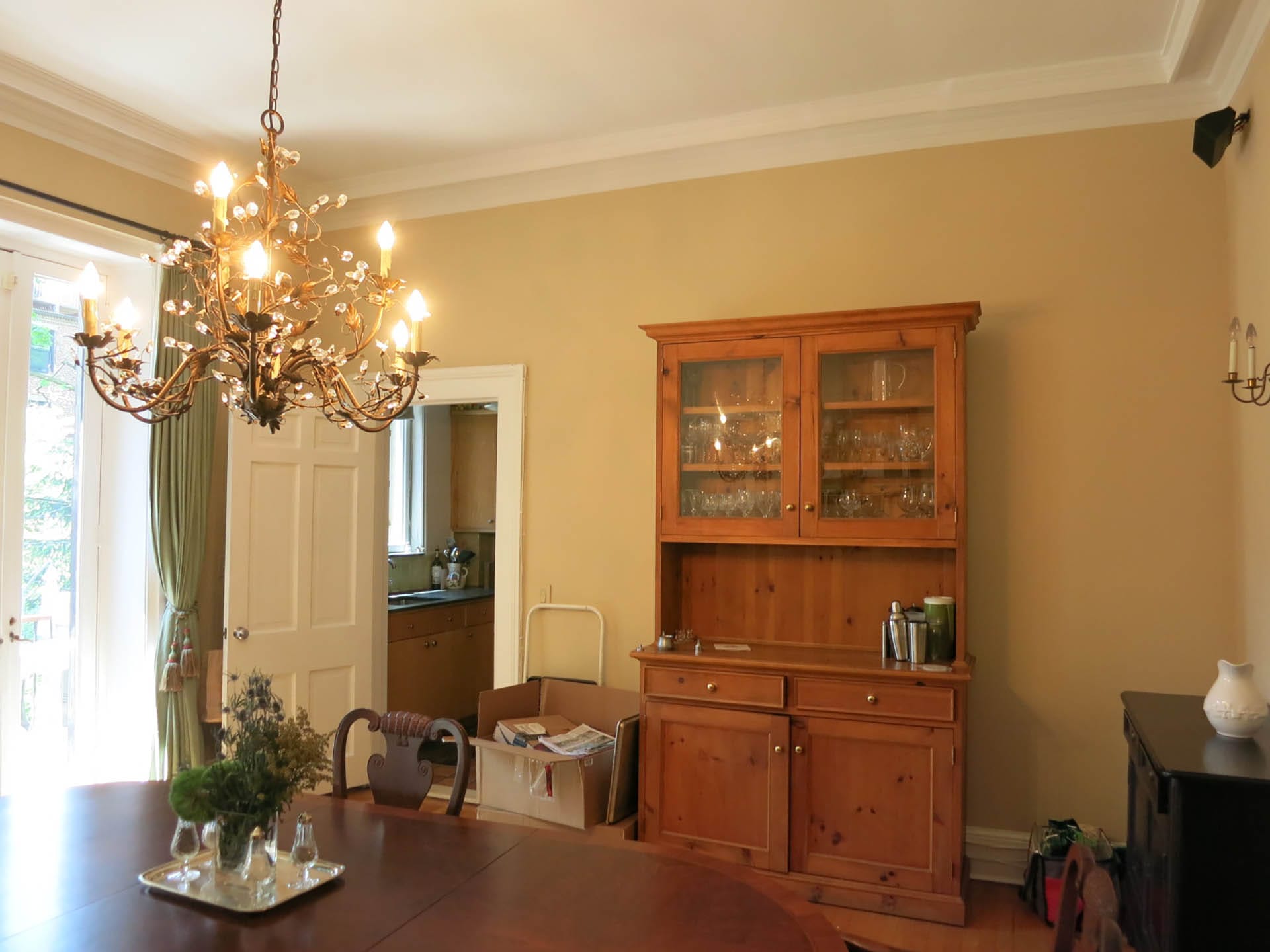 Dining room and kitchen, visible through an open door, at the rear of a Brooklyn Heights townhouse before our renovation