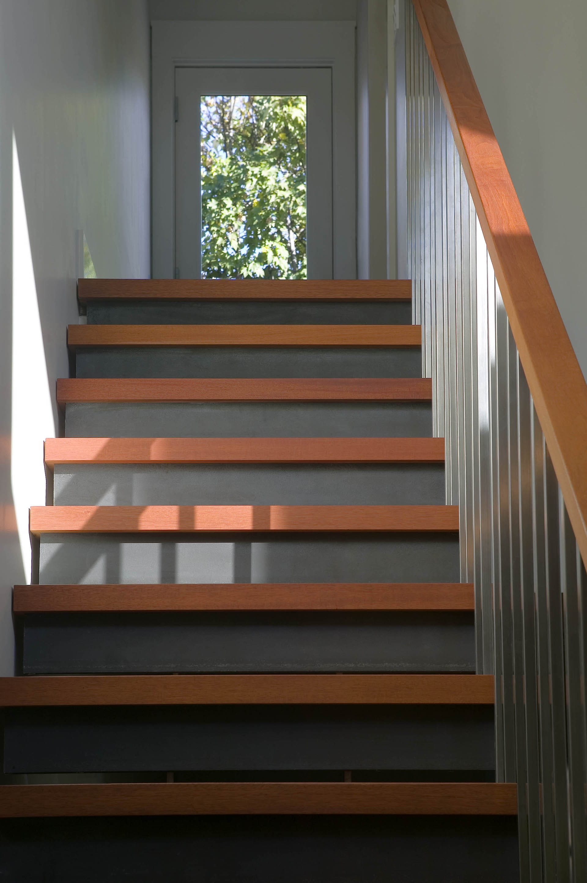 A modern wood and metal staircase in a Cobble Hill townhouse