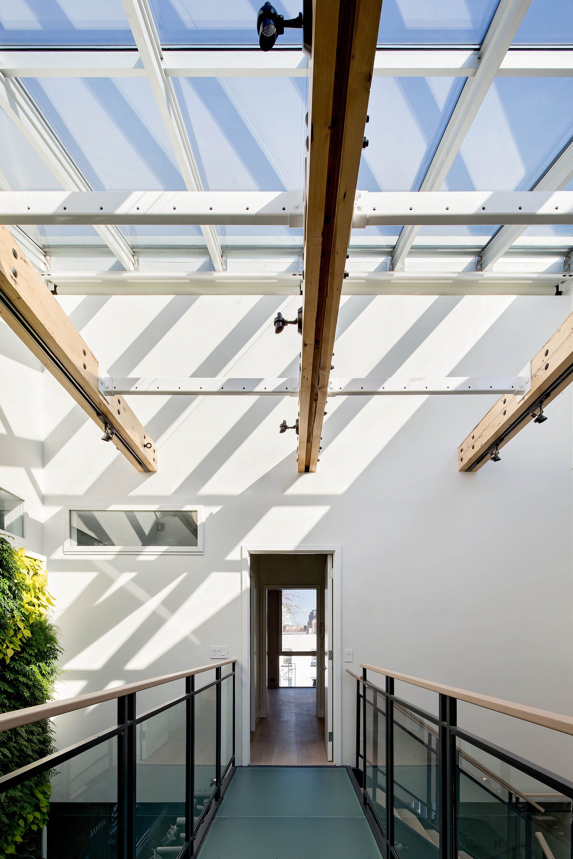 Floating walkway above a very large skylight