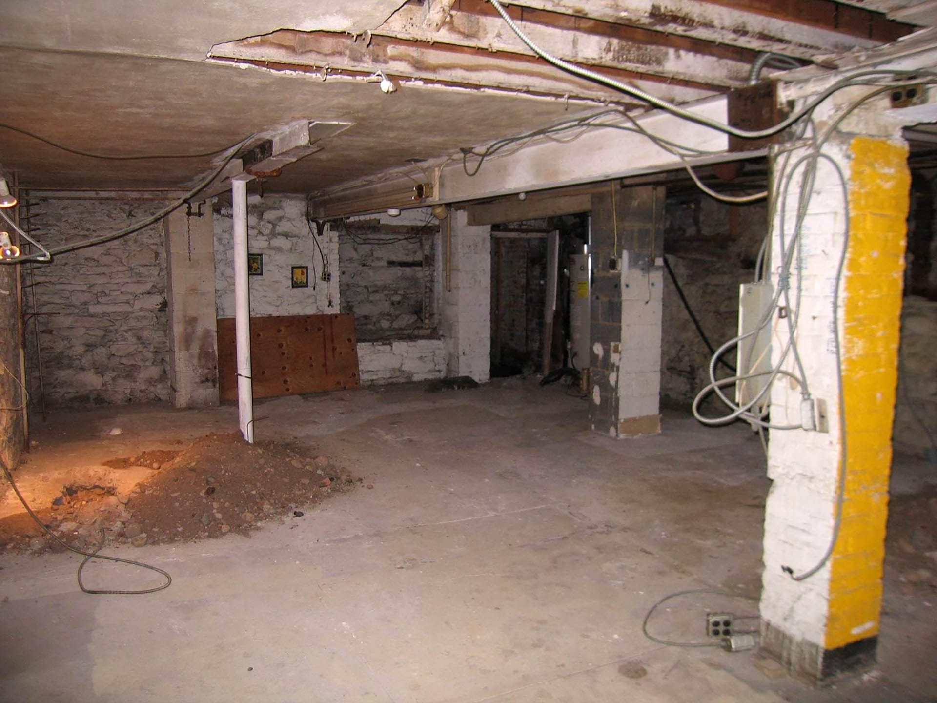 Unfinished cellar in a Cobble Hill carriage house before our renovation