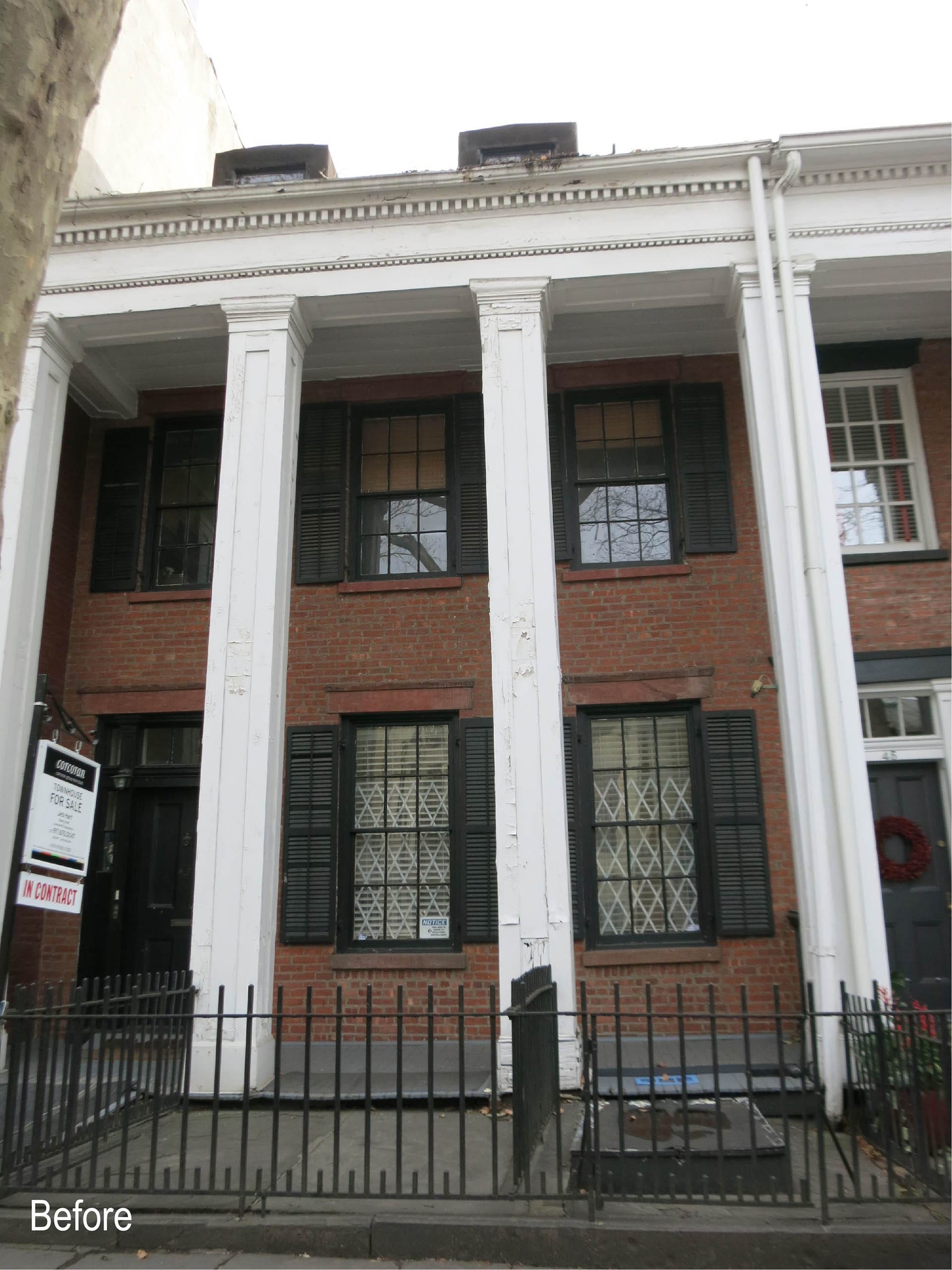 Front façade of a colonnade rowhouse before our renovation