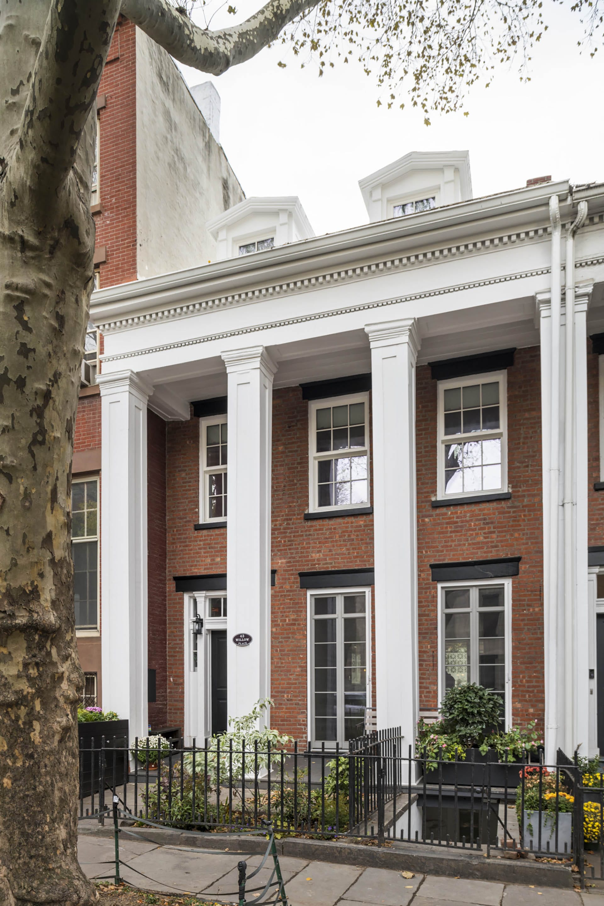 Front facade of a colonnade Passive House in the Brooklyn Heights Historic District.