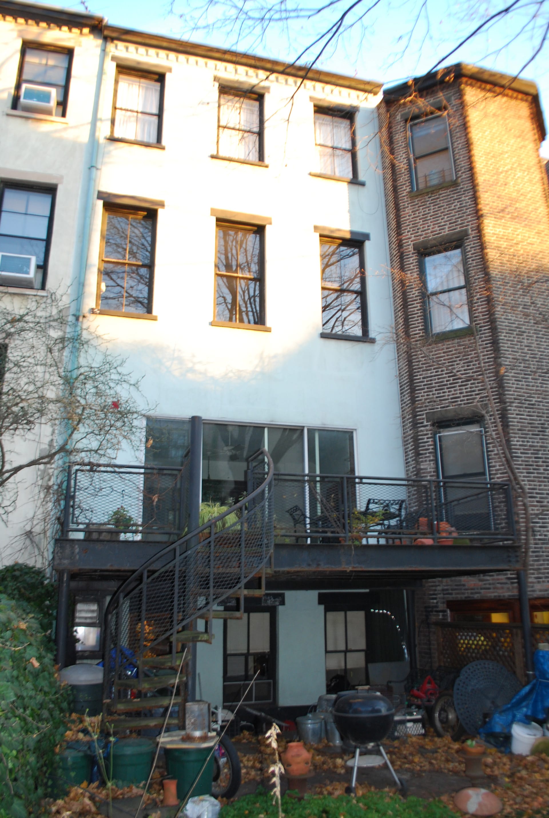 Rear facade of a Brooklyn Heights home with white painted brick before our renovation.