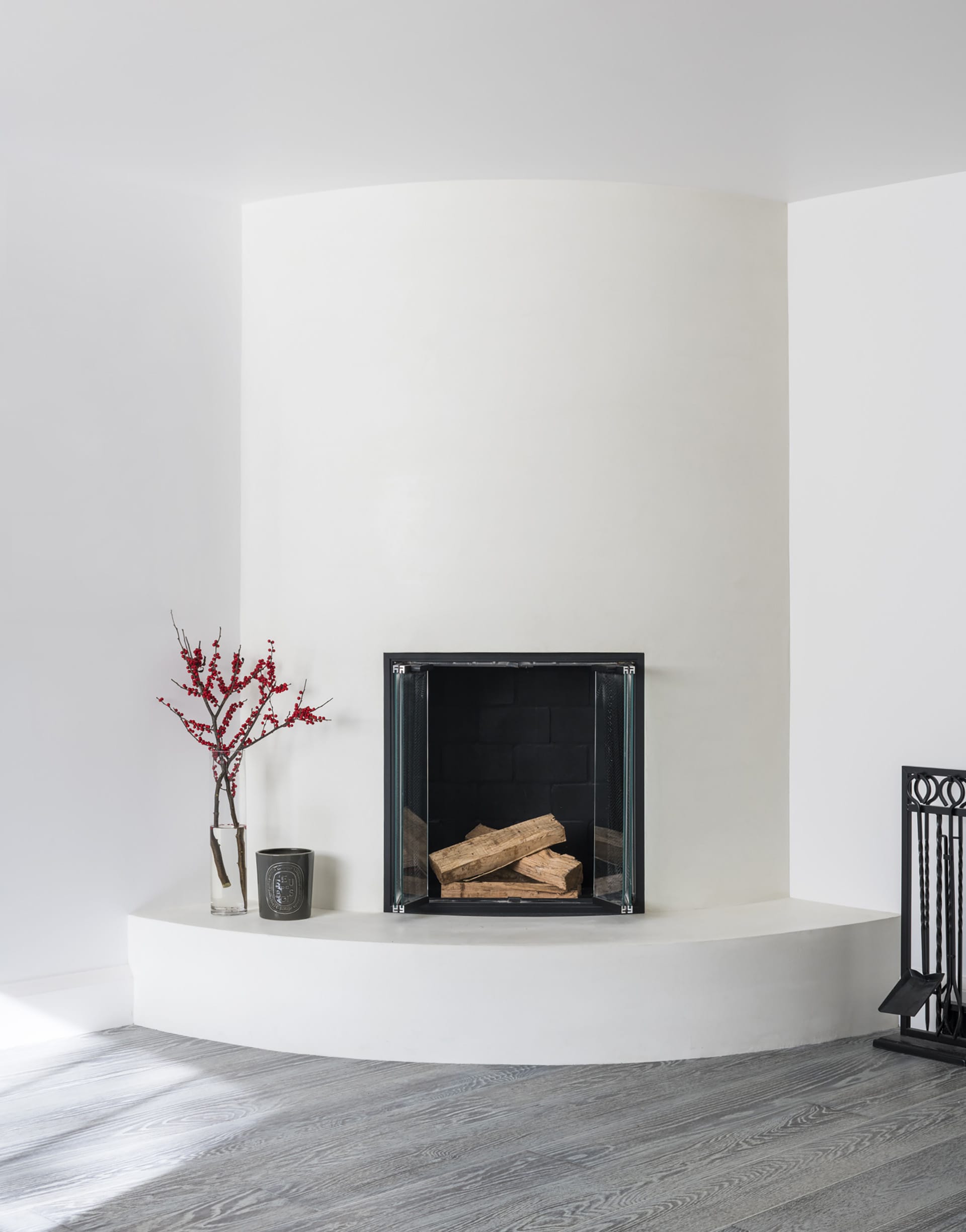 Round fireplace in the garden floor apartment of a Brooklyn Heights townhouse