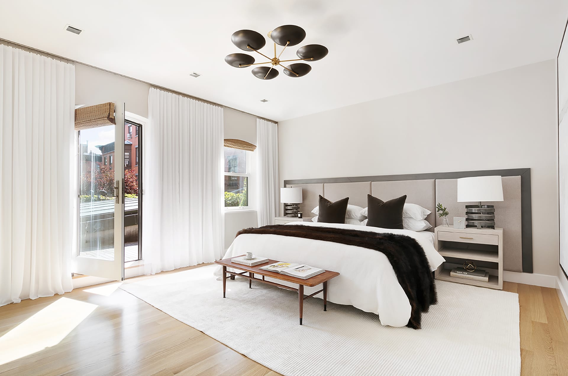 Primary bedroom with a door leading out to a balcony