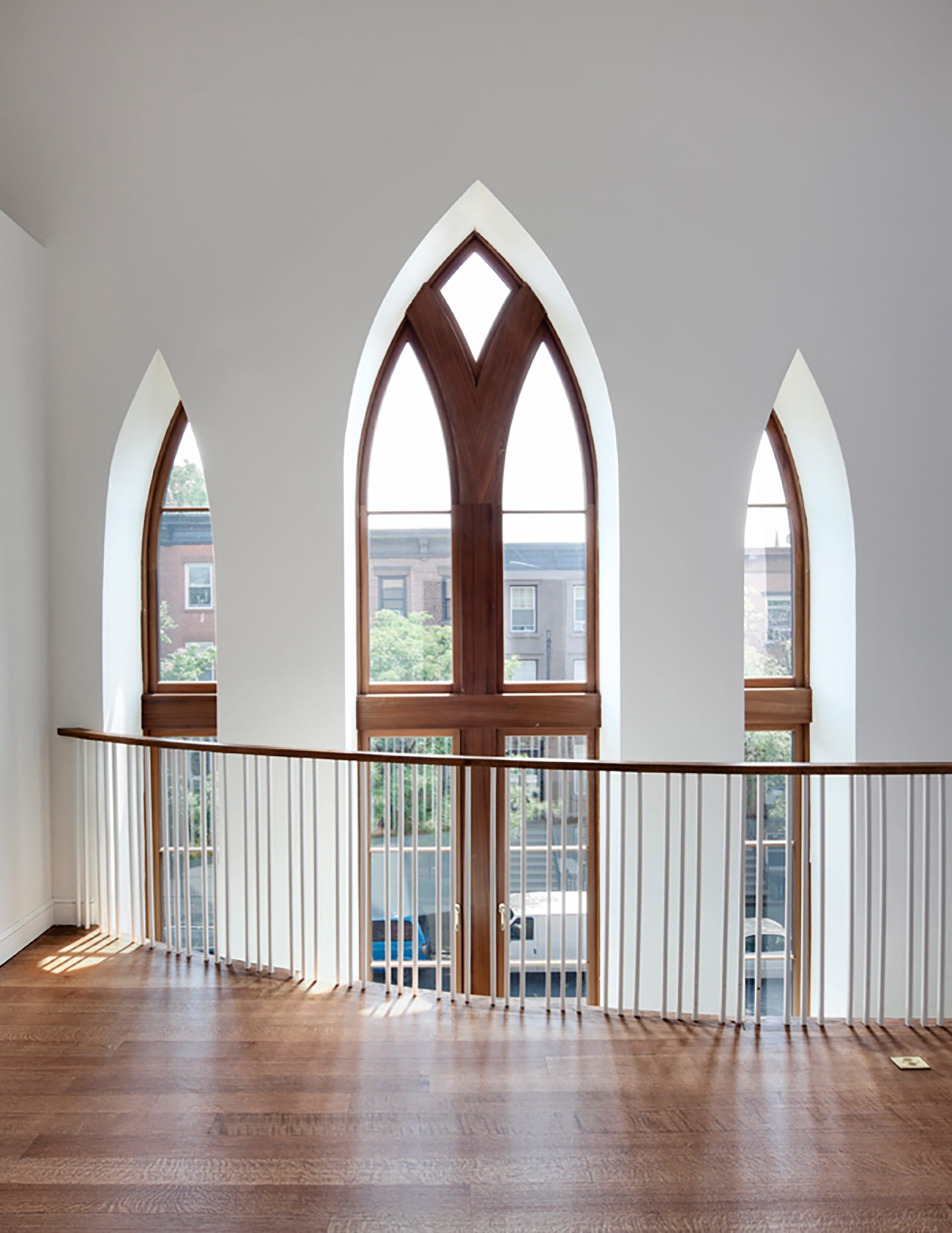 Three pointed arch-top windows in a Brooklyn condo unit that was converted from a church