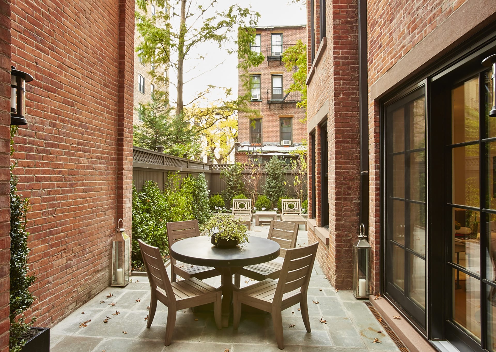 Rear garden of a Brooklyn Heights Passive House with outdoor seating.