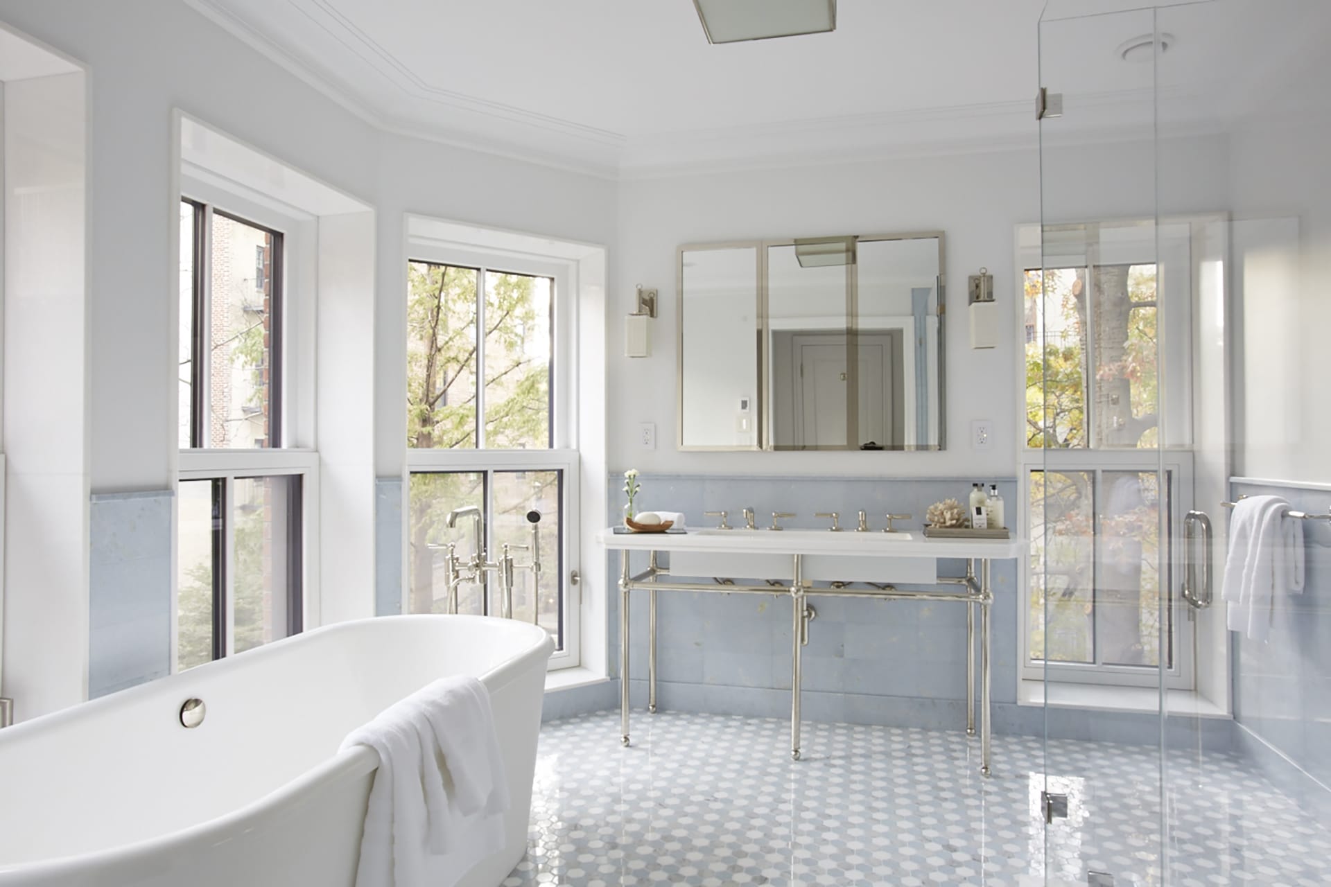 Freestanding bathtub, shower stall, and vanity in the primary bathroom of a Brooklyn Heights Passive House