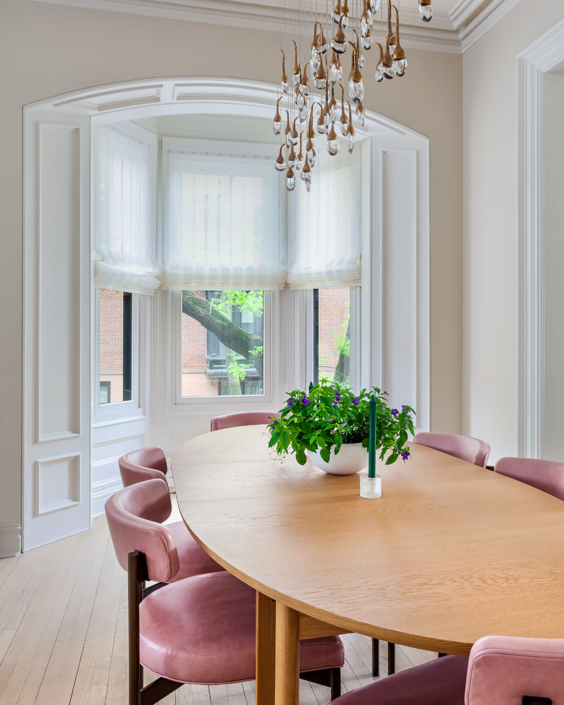 Bay window of a Park Slope home after renovation, widened and painted white to allow more natural light to enter the room.
