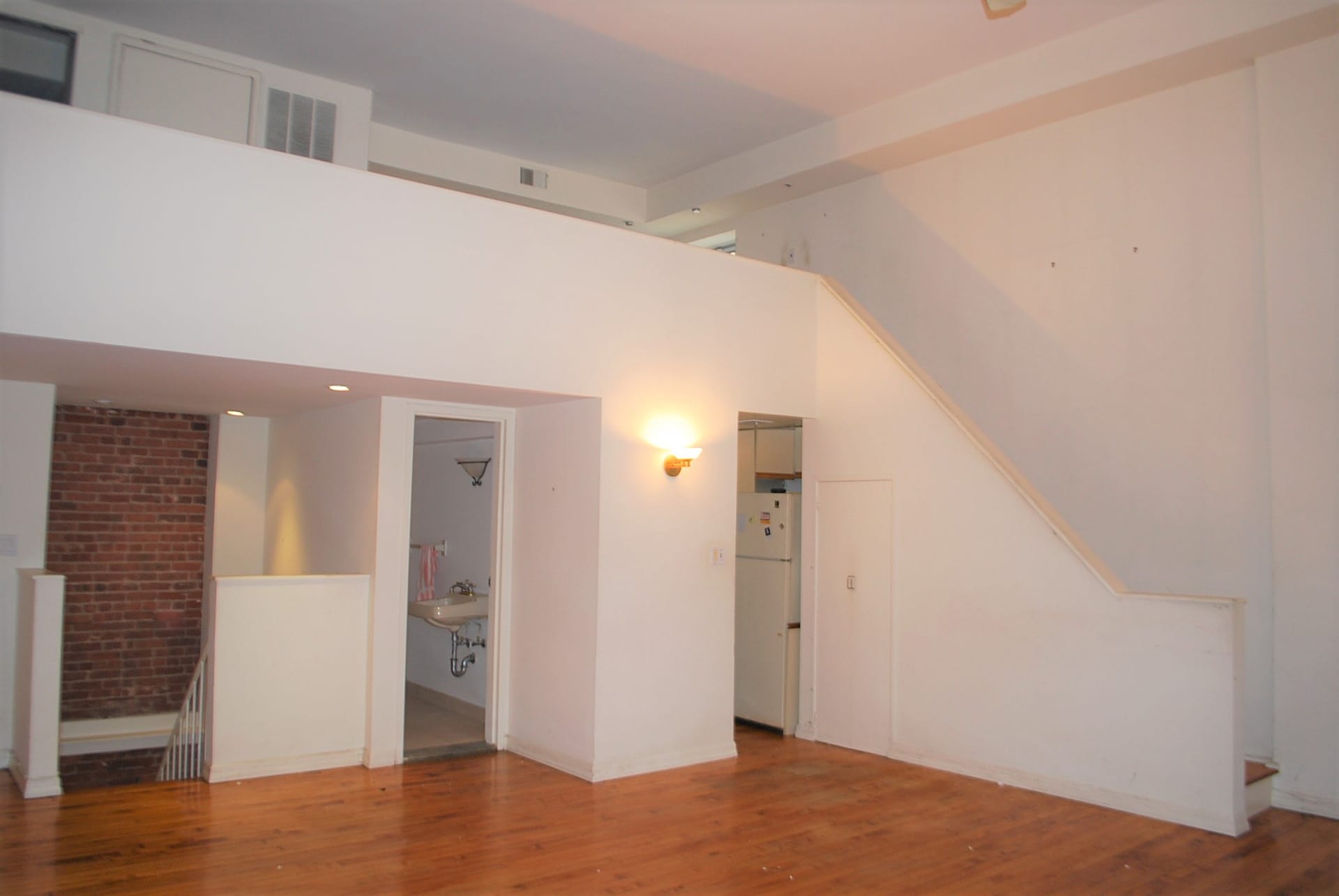 Living space and walled-off kitchen before our renovation