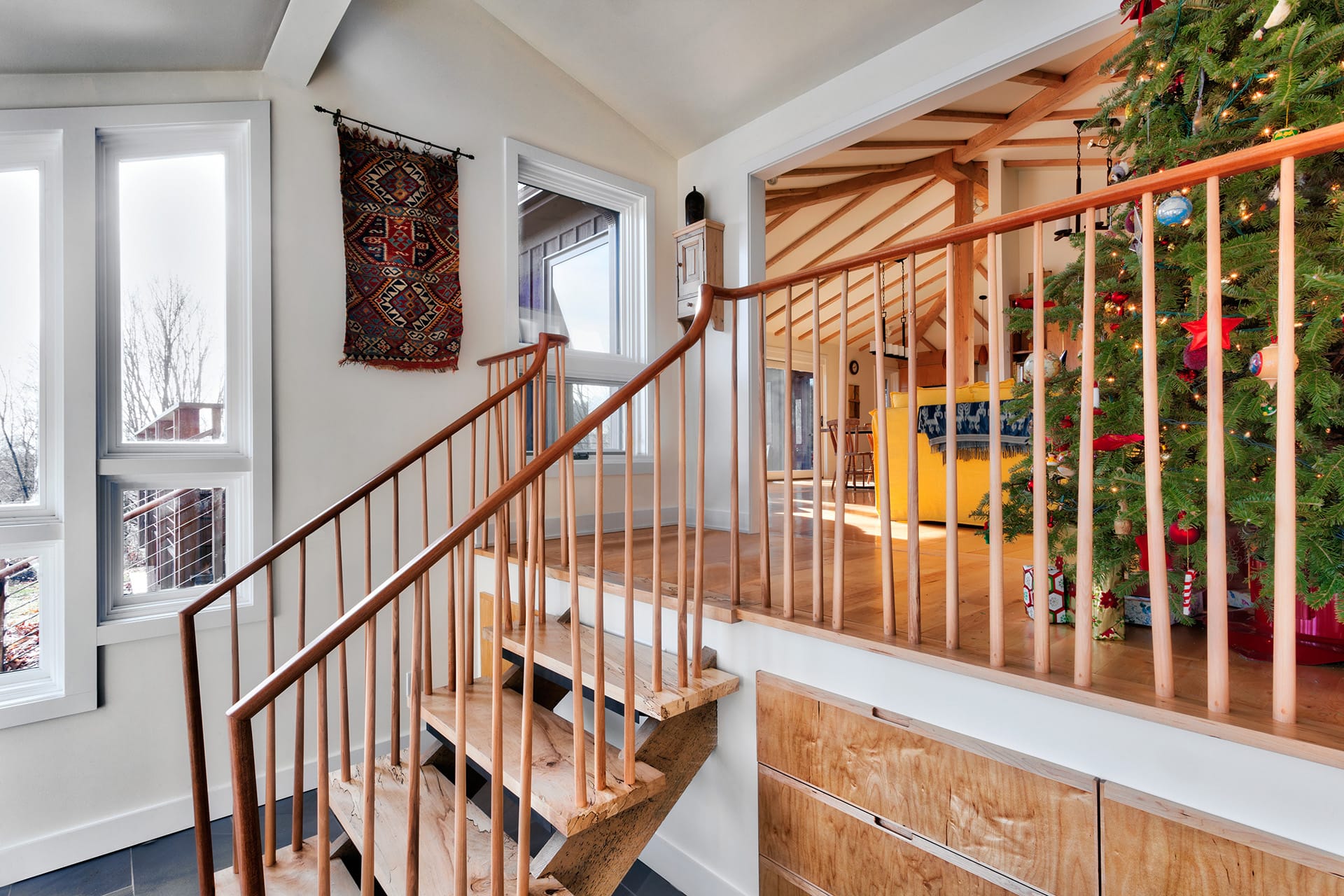 Staircase at the entryway of a Connecticut home, leading up to the main living area