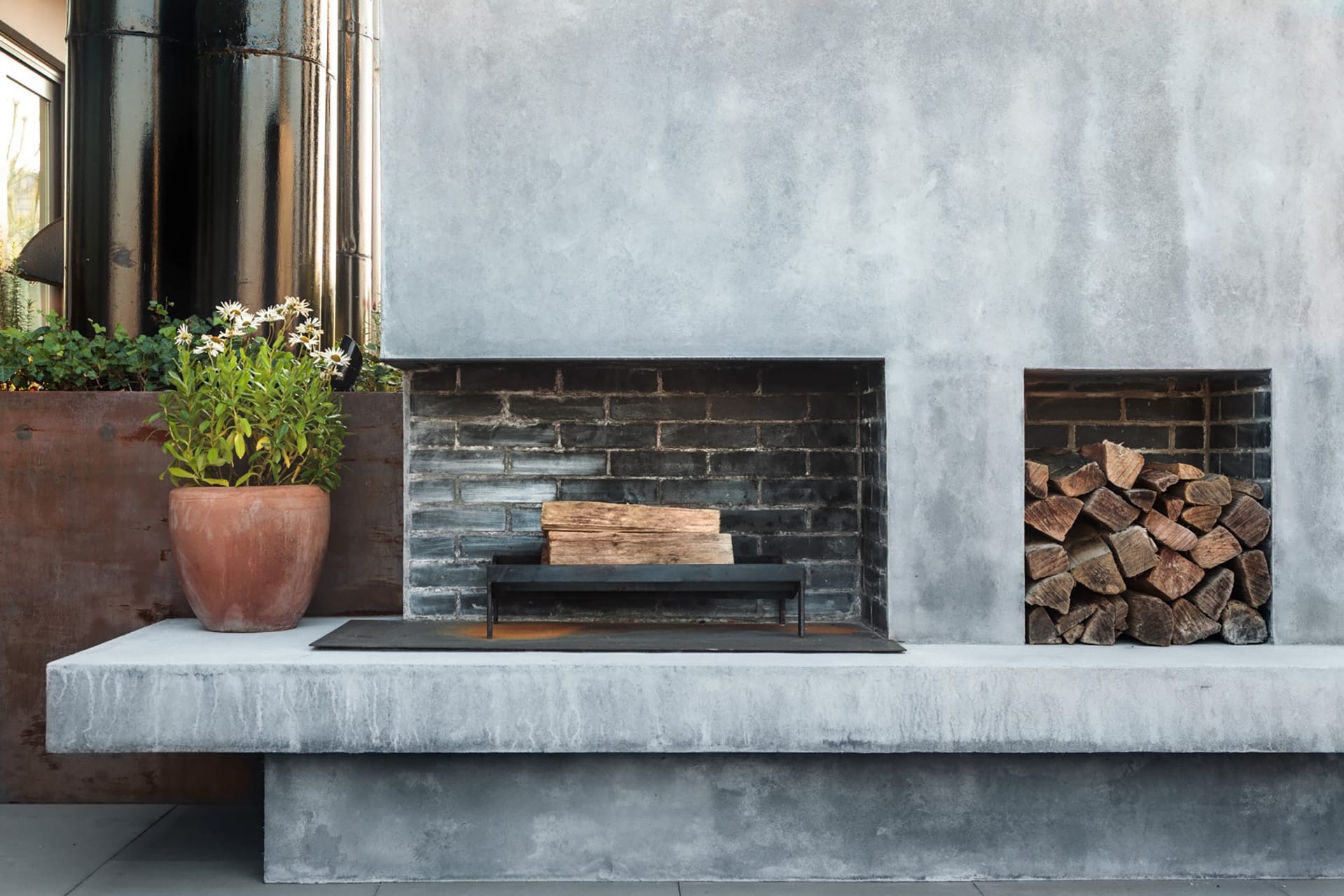 Wood-burning fireplace on the roof deck of a West Village penthouse