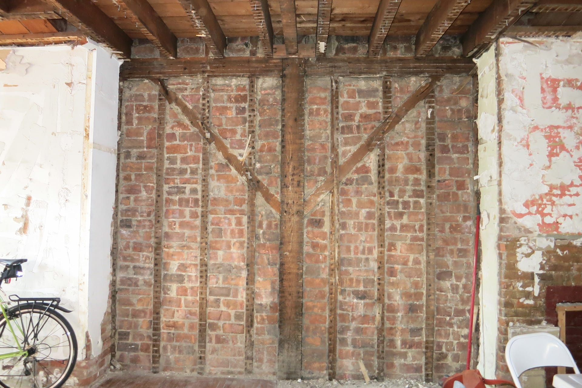 Uncovered brick infill in a Greenpoint townhouse during demolition.